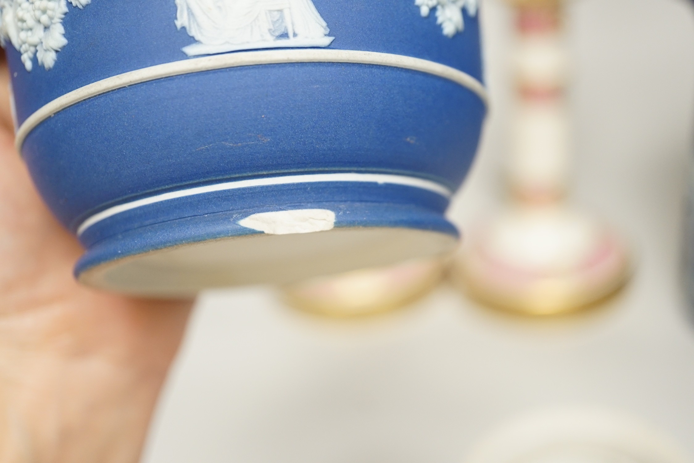 Three mid to late 19th century pieces of Wedgwood Jasperware, including a coffee pot and a small cache-pot, a pair of 19th century porcelain candlesticks converted into lamps
